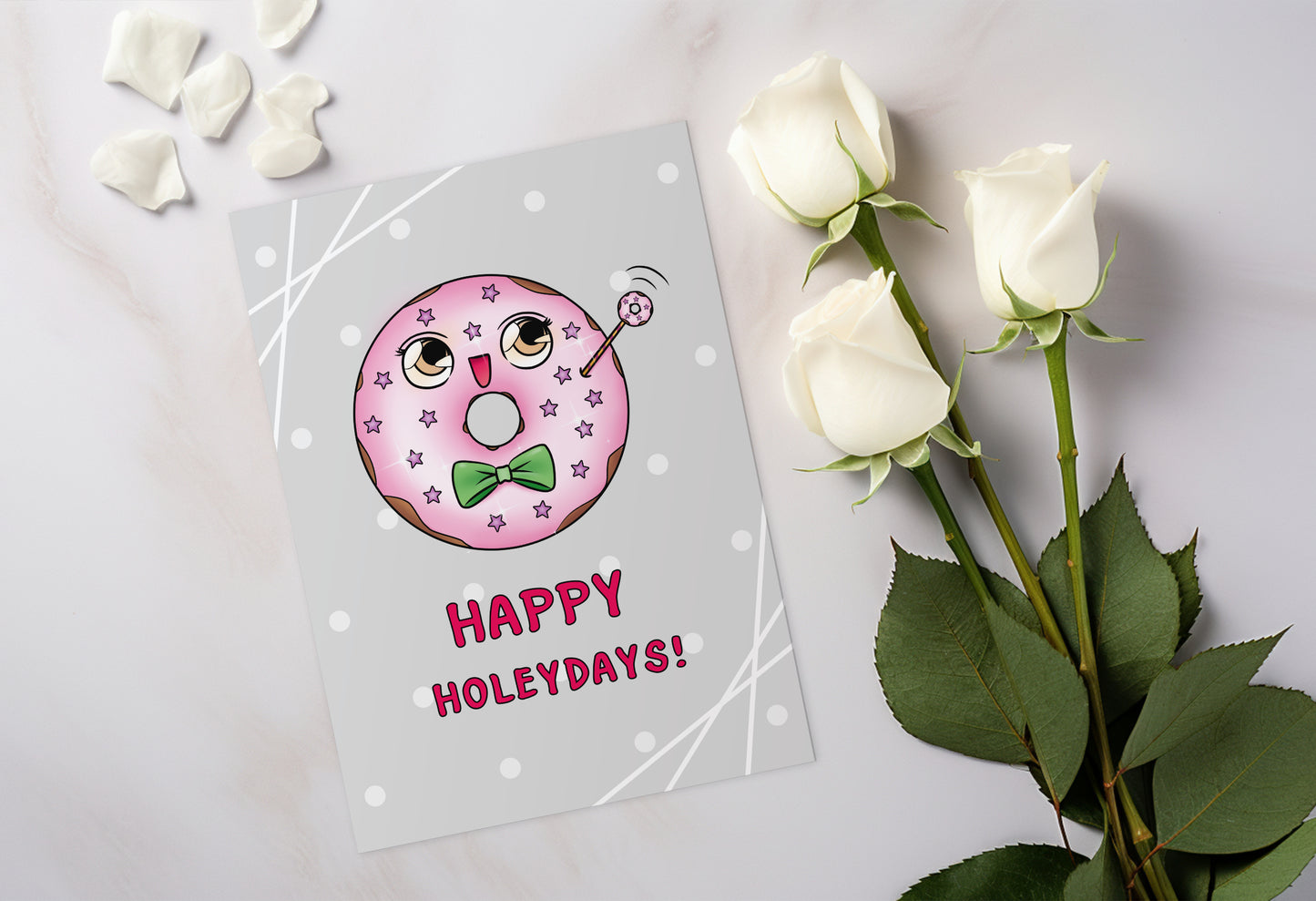 A kawaii greeting card from Rainbow & Bubbles, showing a kawaii glazed donut with a fancy bowtie saying Happy Holeydays!