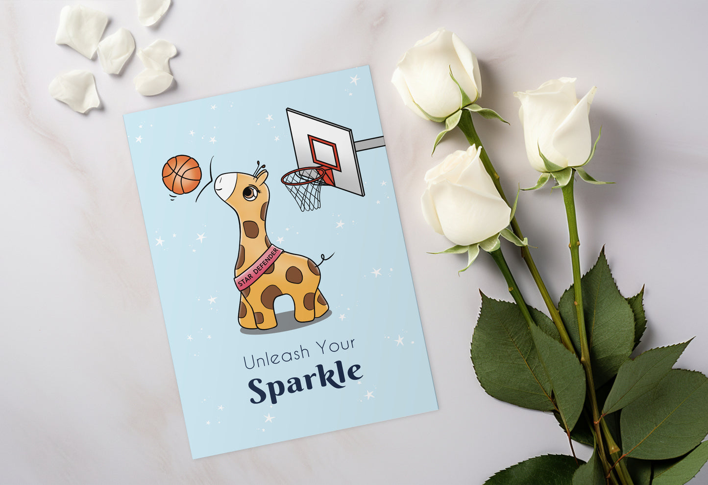 A kawaii greeting card from Rainbow & Bubbles, showing Baby Giraffe in her element as the Star Defender at basketball. The front says "Unleash your sparkle".