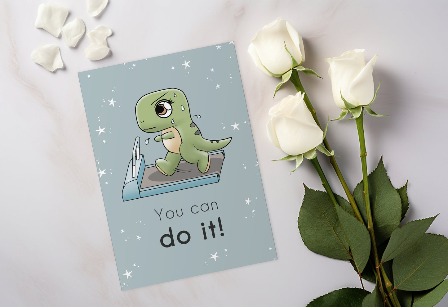 A kawaii greeting card from Rainbow & Bubbles, showing a t-rex running and sweating on the treadmill. The front says "You can do it!"