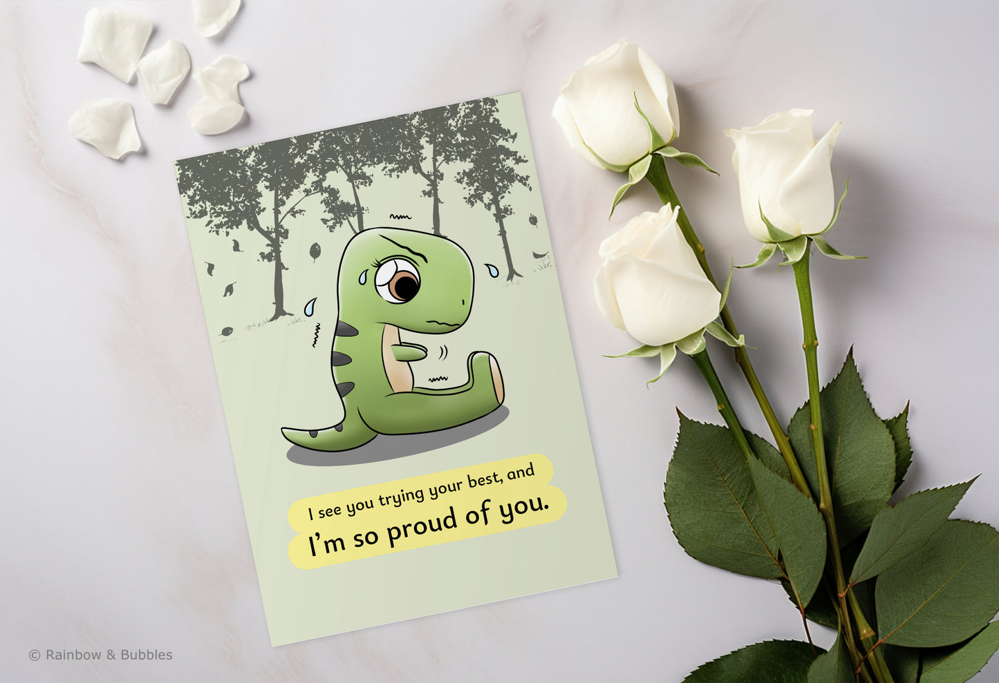A kawaii greeting card from Rainbow & Bubbles, showing a t-rex stretching and struggling to touch his toes with his little arms.