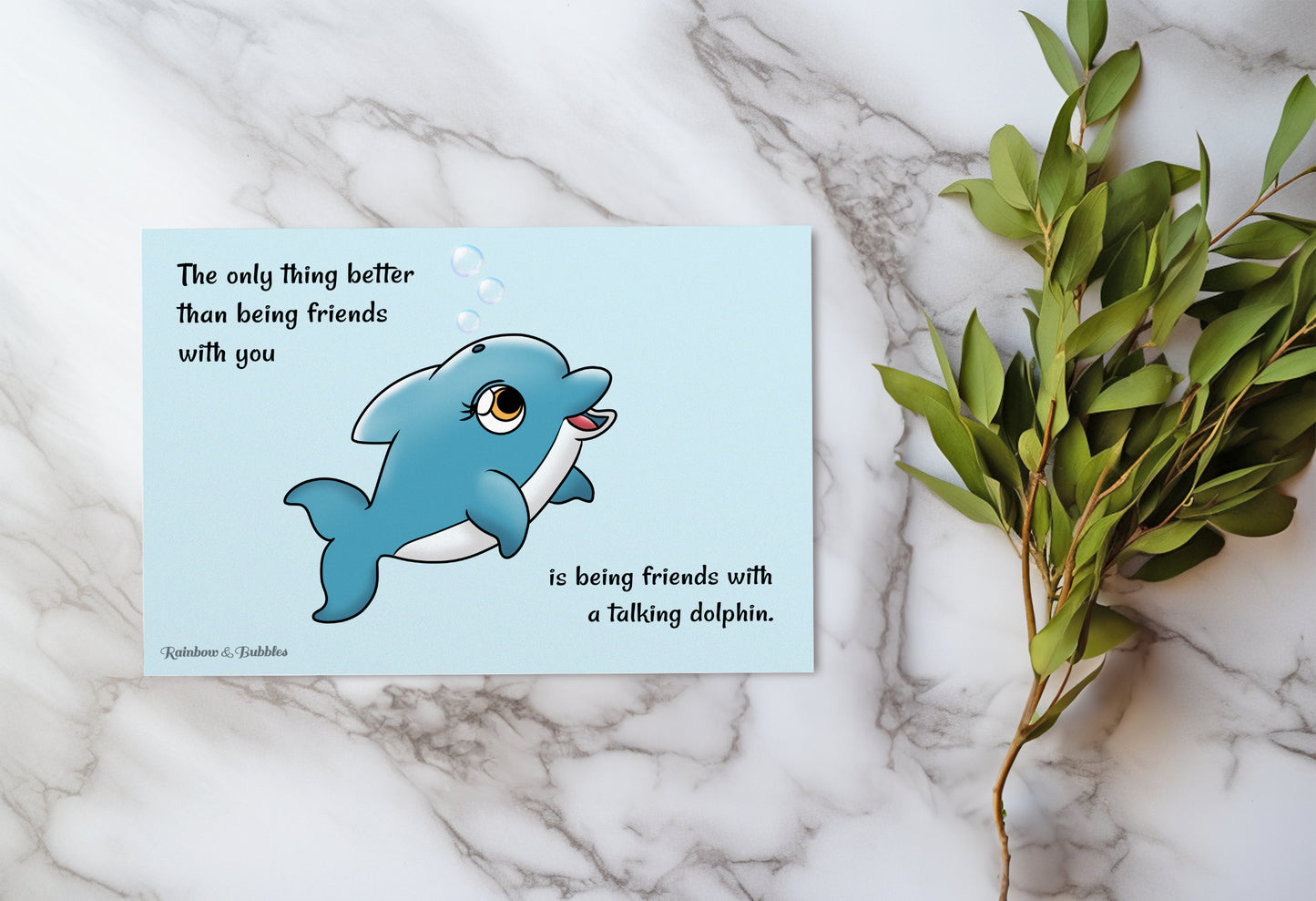 A kawaii postcard from Rainbow & Bubbles, showing a happy dolphin blowing bubbles.