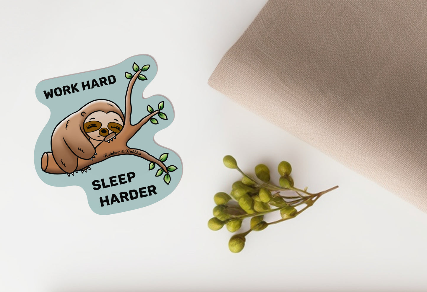 Baby Sloth sleeping on a branch kawaii vinyl sticker from Rainbow & Bubbles, with "work hard, sleep harder" text.
