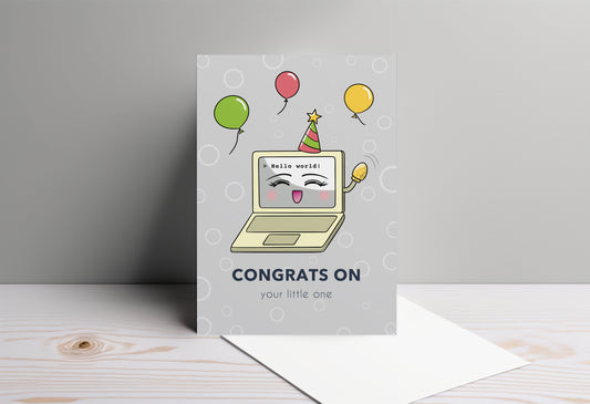 A kawaii greeting card from Rainbow & Bubbles, showing a laptop displaying Hello world! Baby Laptop is celebrating the birth of a baby. The front says "Congrats on your little one".