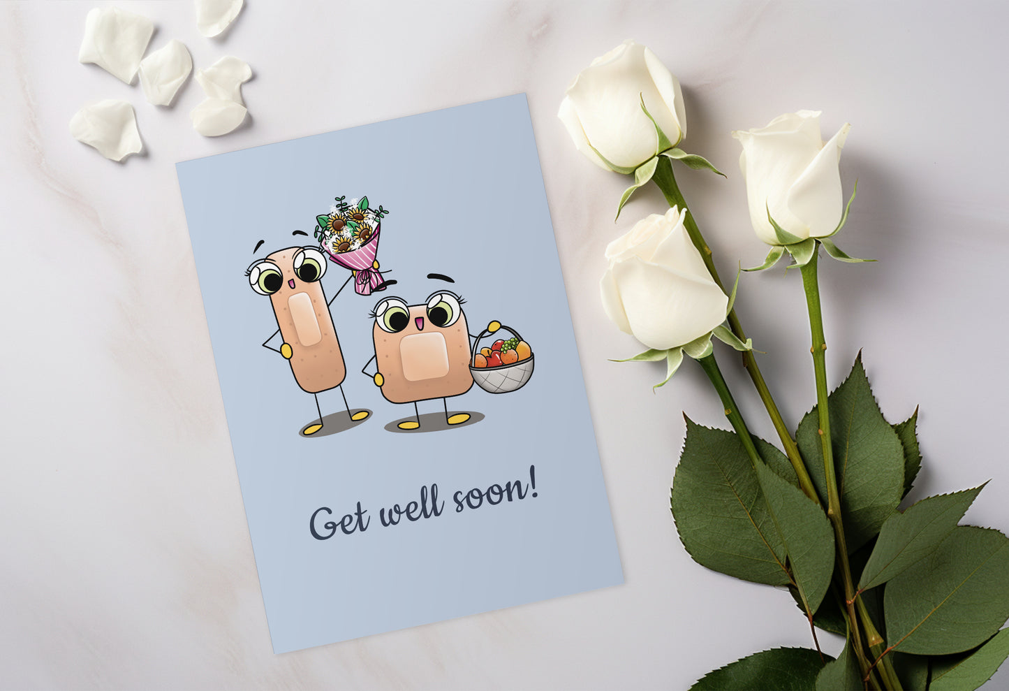 A kawaii greeting card from Rainbow & Bubbles, showing two kawaii bandages holding a flower bouquet and a fruit basket, with the text Get Well Soon.