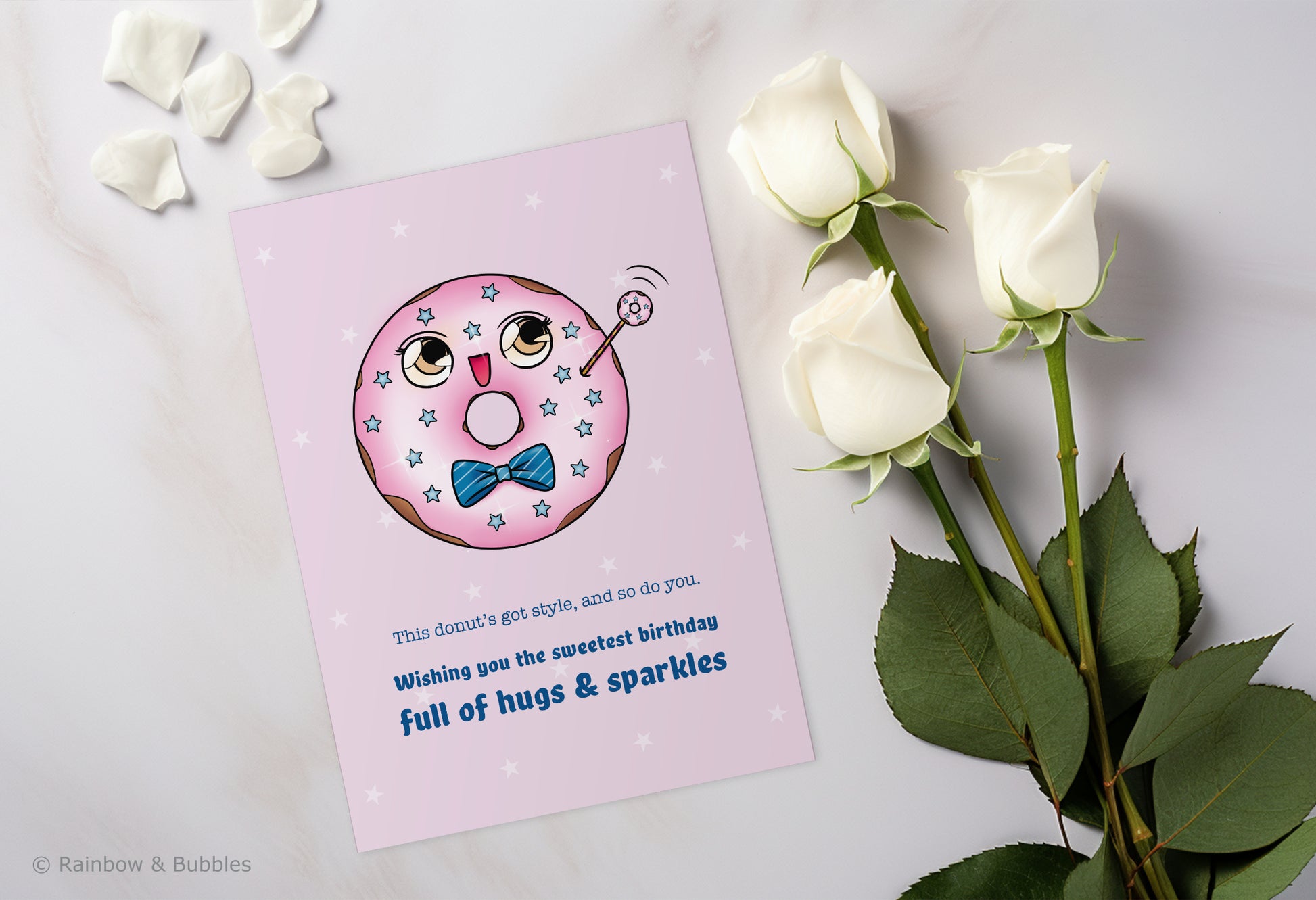 A kawaii birthday card from Rainbow & Bubbles, showing a kawaii glazed donut with a fancy bowtie waving at you.