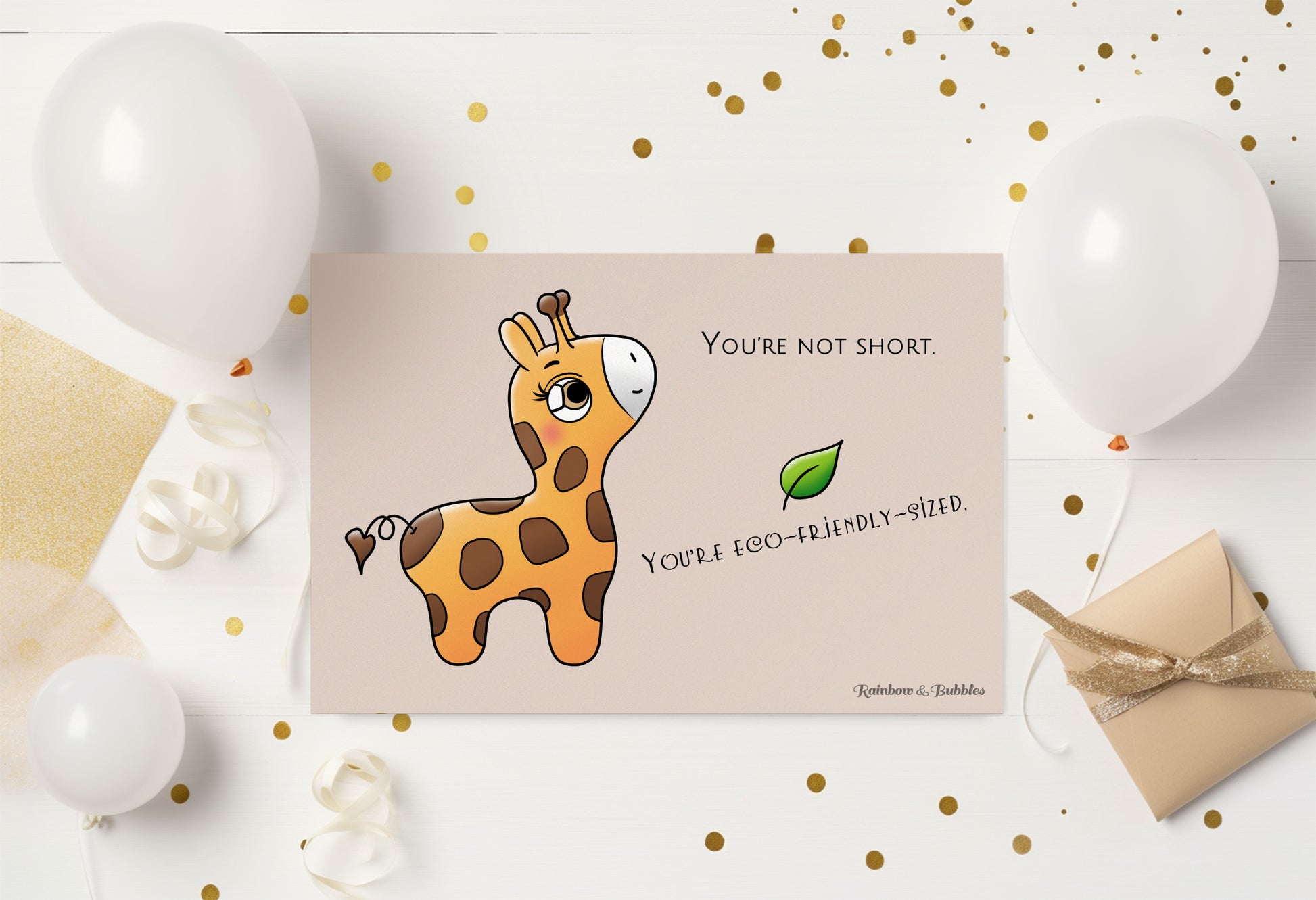 A kawaii postcard from Rainbow & Bubbles, showing a baby giraffe who's looking very pleased.