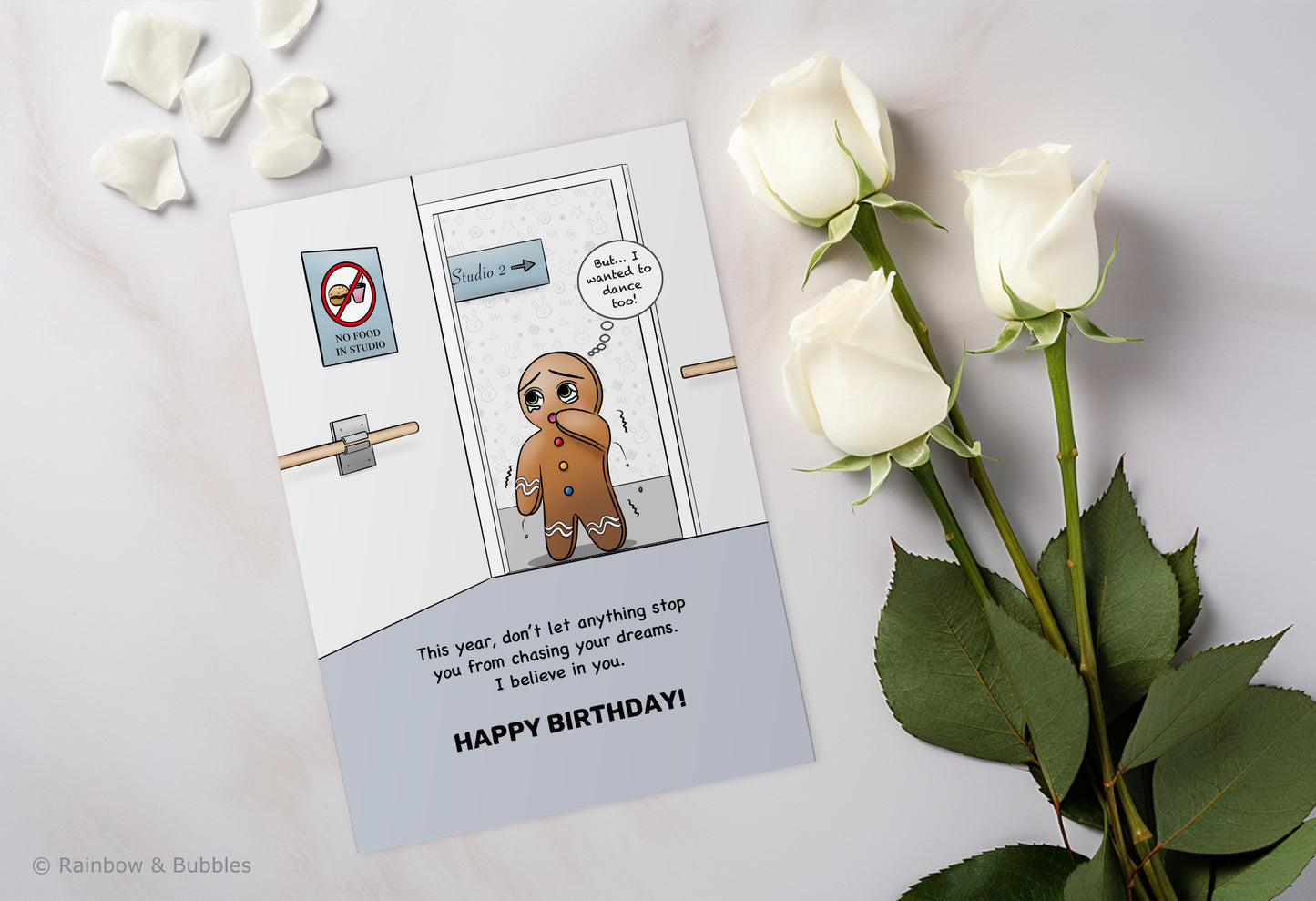A kawaii birthday card from Rainbow & Bubbles, showing a gingerbread man who is facing an obstacle in his journey towards his dreams.