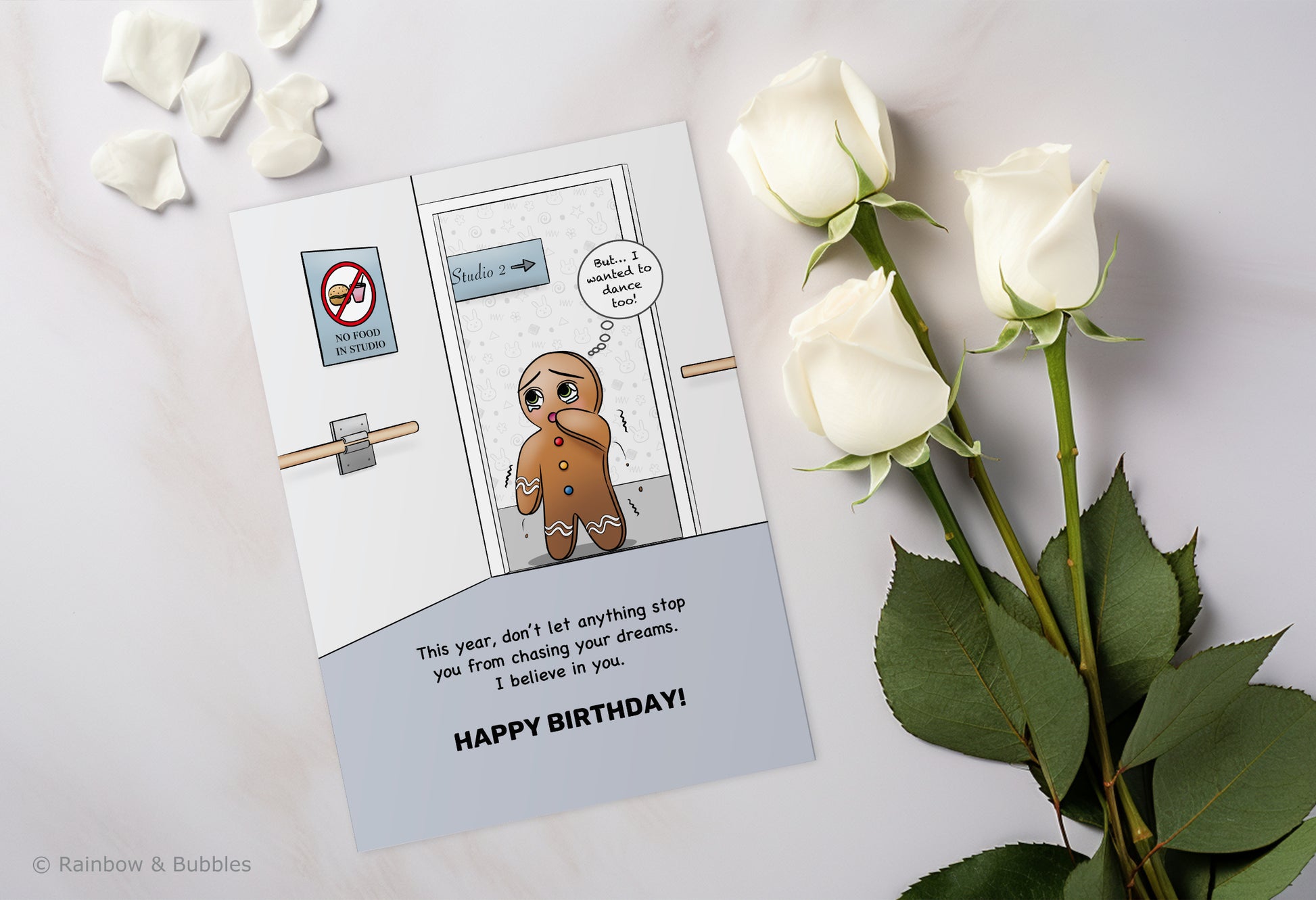 A kawaii birthday card from Rainbow & Bubbles, showing a gingerbread man who is facing an obstacle in his journey towards his dreams.