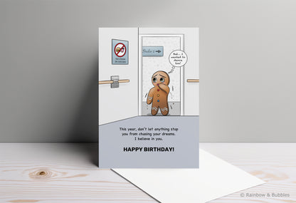 A kawaii birthday card from Rainbow & Bubbles, showing a gingerbread man who is facing an obstacle in his journey towards his dreams.