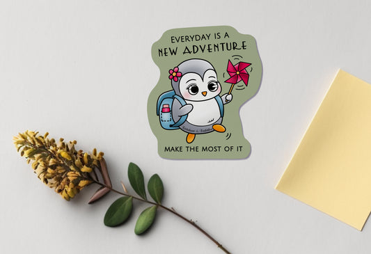Little Penguin going on an adventure called "today", with a water bottle, a nice flower hair clip, and a pinwheel for fun. Kawaii vinyl sticker from Rainbow & Bubbles, with "everyday is a new adventure, make the most of it" text.