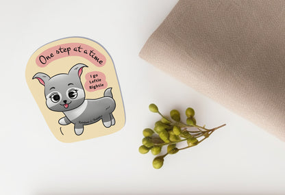 Little Puppy taking one step at a time, kawaii vinyl sticker from Rainbow & Bubbles. Text reads "one step at a time, I go Leftie, Rightie".