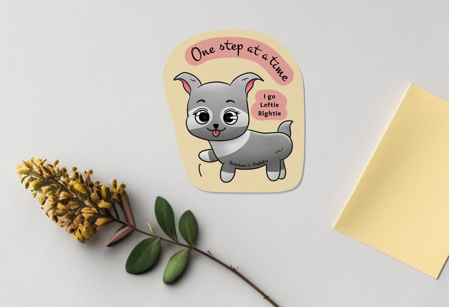 Little Puppy taking one step at a time, kawaii vinyl sticker from Rainbow & Bubbles. Text reads "one step at a time, I go Leftie, Rightie".