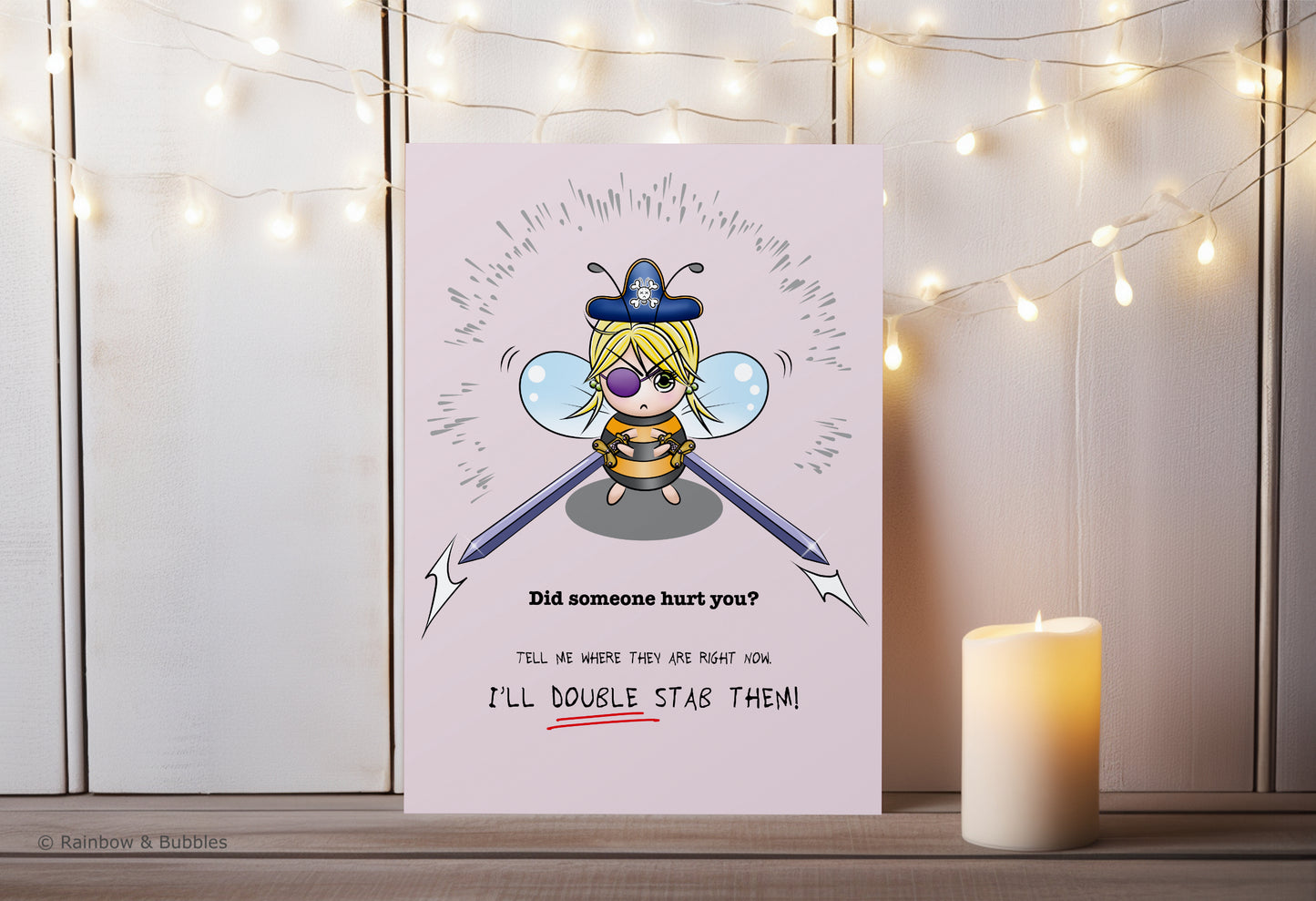 A kawaii greeting card from Rainbow & Bubbles, showing a pirate bee with massive swords.