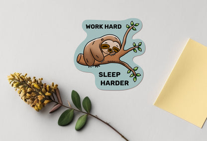 Baby Sloth sleeping on a branch kawaii vinyl sticker from Rainbow & Bubbles, with "work hard, sleep harder" text.